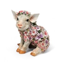 Blumenschwein sitzend