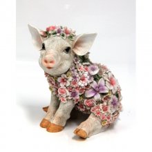 Blumenschwein sitzend